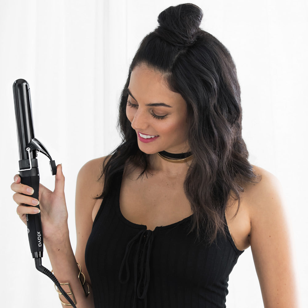 woman with xtava curling iron